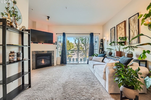 carpeted living area with a fireplace
