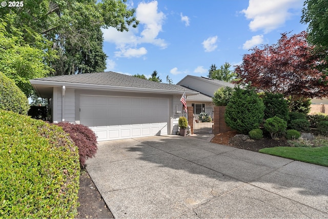 7250 SW Arbor Lake Dr, Wilsonville, OR 97070 - ranch-style house with concrete driveway and a garage