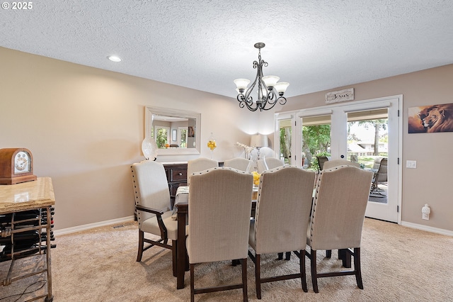 7250 SW Arbor Lake Dr, Wilsonville, OR 97070 - dining area with a chandelier, light carpet, baseboards, a textured ceiling, and recessed lighting