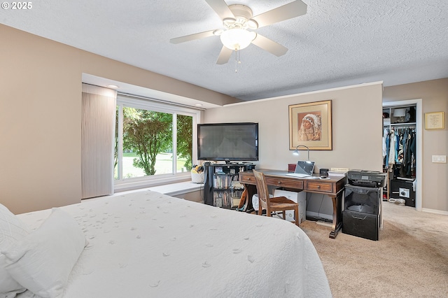 7250 SW Arbor Lake Dr, Wilsonville, OR 97070 - bedroom featuring a textured ceiling, light carpet, a closet, a desk, and a ceiling fan