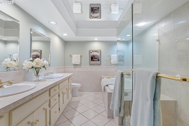 7250 SW Arbor Lake Dr, Wilsonville, OR 97070 - full bathroom with tile walls, tile patterned floors, double vanity, toilet, and tiled shower