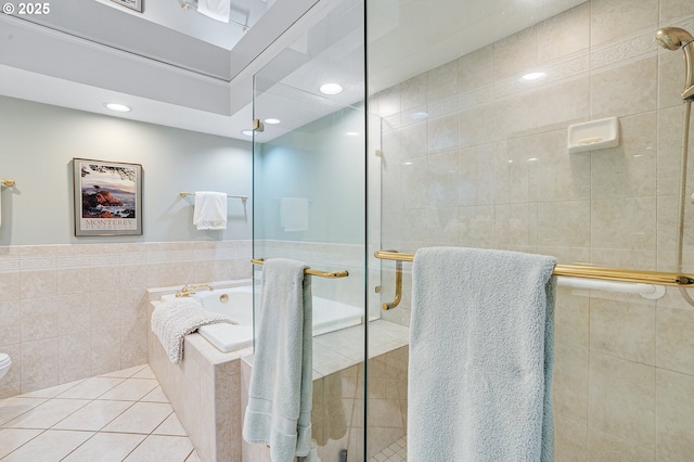 7250 SW Arbor Lake Dr, Wilsonville, OR 97070 - full bath featuring a tub with jets, a shower stall, tile walls, tile patterned flooring, and toilet