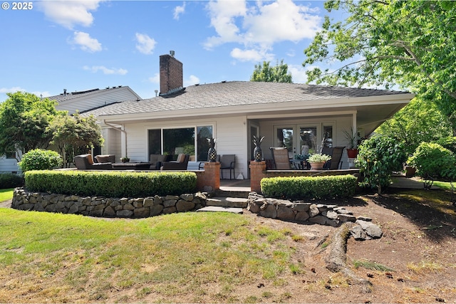7250 SW Arbor Lake Dr, Wilsonville, OR 97070 - rear view of house with a yard, outdoor lounge area, a chimney, and a patio