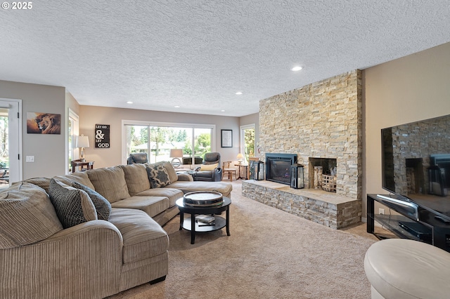 7250 SW Arbor Lake Dr, Wilsonville, OR 97070 - carpeted living room featuring a stone fireplace, recessed lighting, and a textured ceiling