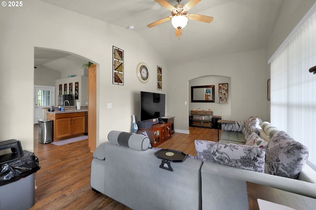 25246 Corky Ln, Veneta, OR 97487 - living room featuring arched walkways, lofted ceiling, wood finished floors, and a ceiling fan