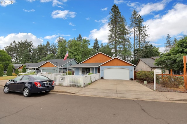 25246 Corky Ln, Veneta, OR 97487 - ranch-style home featuring a fenced front yard, a garage, and concrete driveway
