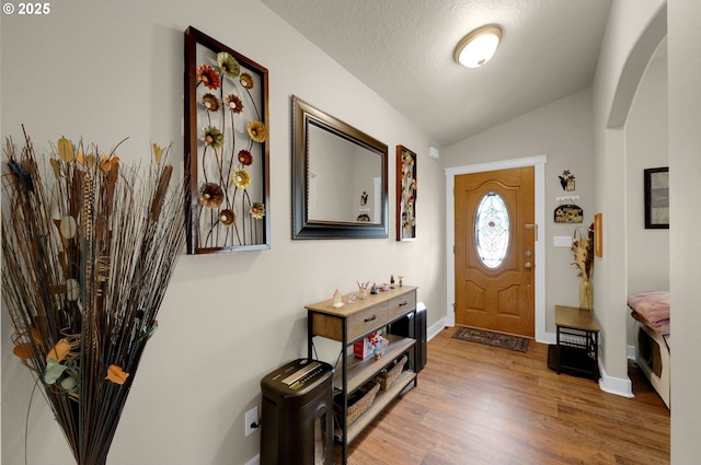 25246 Corky Ln, Veneta, OR 97487 - entrance foyer with vaulted ceiling, wood finished floors, and arched walkways