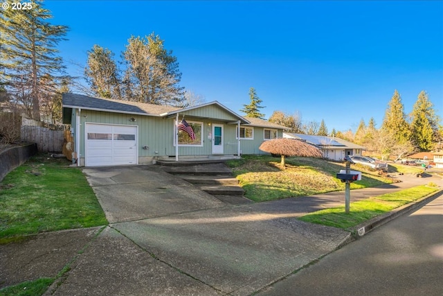 ranch-style house with a front yard and a garage