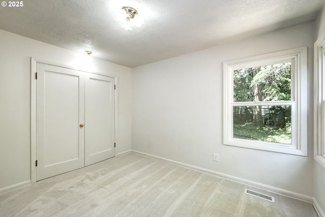 11355 SW 97th Ct, Portland, OR 97223 - unfurnished bedroom with light colored carpet and a textured ceiling