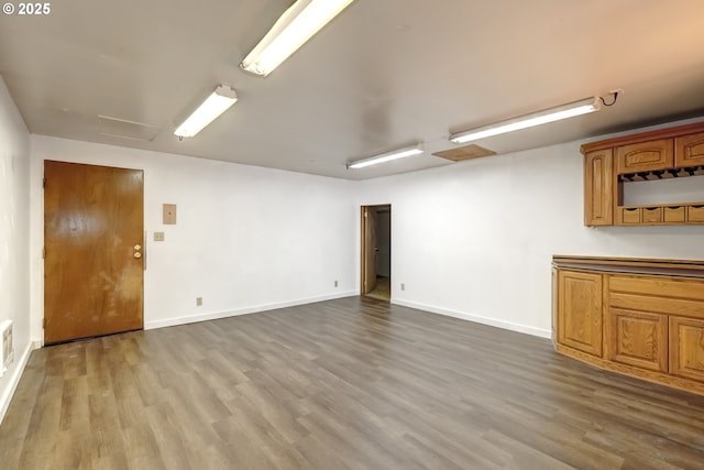 11355 SW 97th Ct, Portland, OR 97223 - unfurnished living room with dark wood-style flooring and attic access