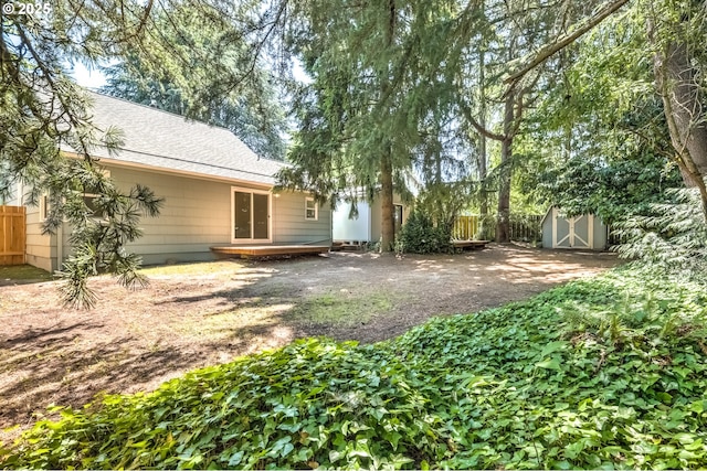 11355 SW 97th Ct, Portland, OR 97223 - view of yard featuring a storage unit and a wooden deck