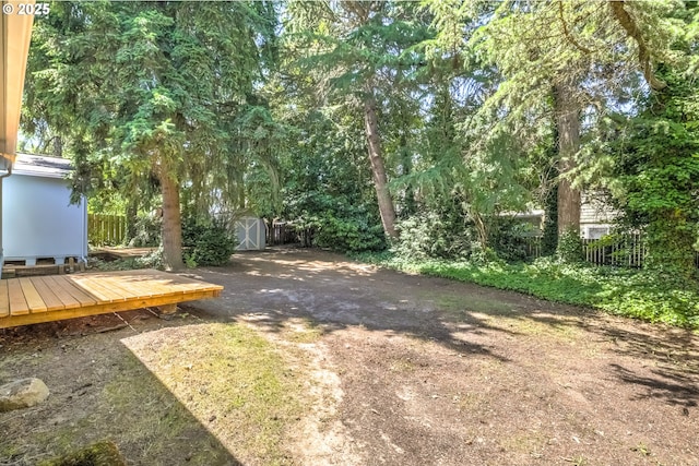 11355 SW 97th Ct, Portland, OR 97223 - view of yard featuring a storage unit and a wooden deck