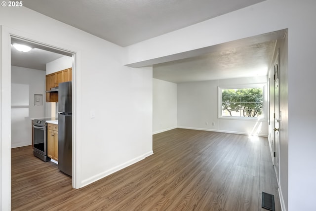 11355 SW 97th Ct, Portland, OR 97223 - spare room featuring dark wood-type flooring and baseboards