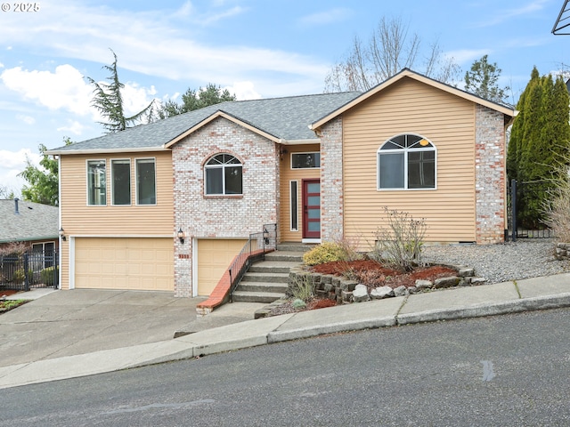 view of front facade featuring a shingled roof, concrete driveway, an attached garage, fence, and brick siding