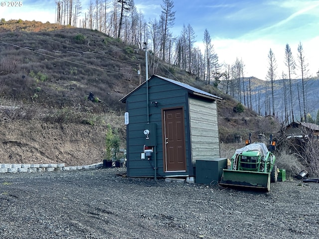 view of shed featuring a mountain view