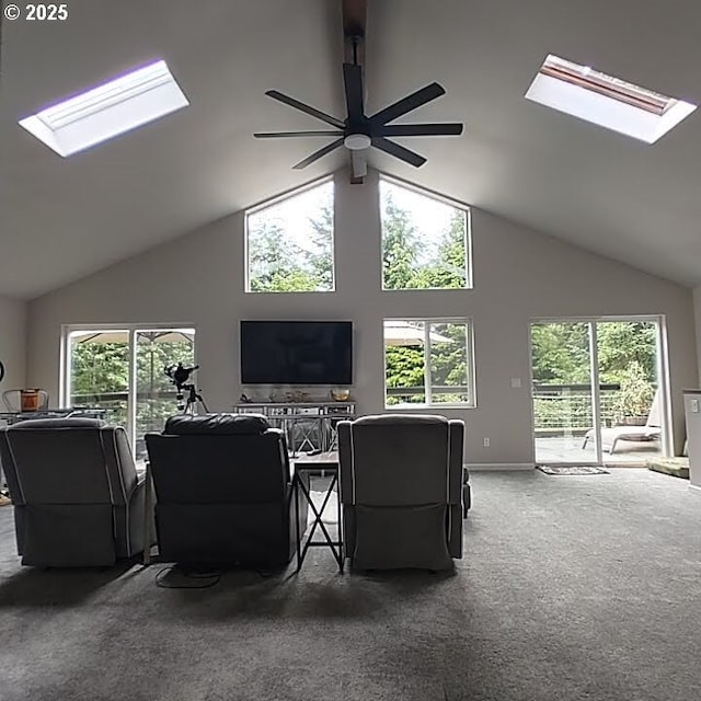 62760 Koski Rd, Coos Bay, OR 97420 - carpeted living area featuring a skylight, high vaulted ceiling, and ceiling fan