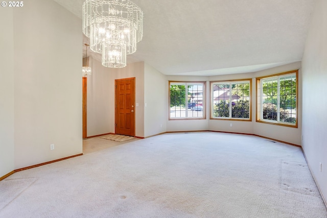 7236 Woodcrest Ct, Keizer, OR 97303 - carpeted spare room with plenty of natural light, a chandelier, and baseboards