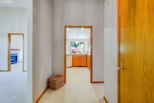 7236 Woodcrest Ct, Keizer, OR 97303 - corridor featuring baseboards, a sink, and light tile patterned floors