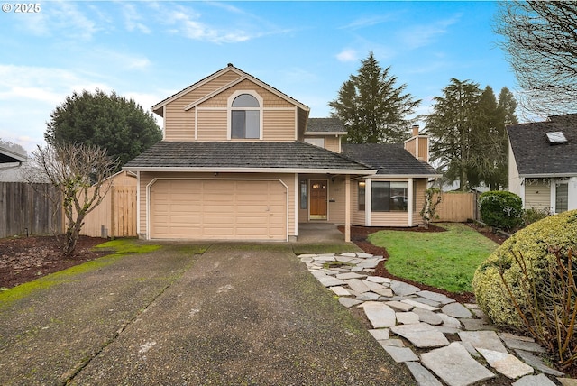 view of front property with a garage and a front lawn