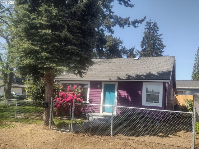 7731 SE 62nd Ave, Portland, OR 97206 - bungalow-style home featuring a fenced front yard and a shingled roof