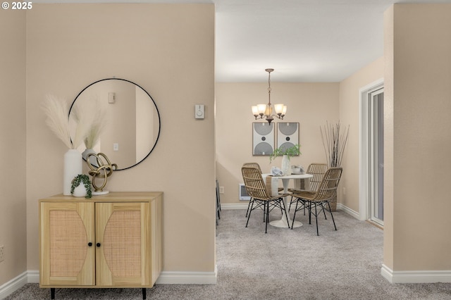 carpeted dining room with a notable chandelier