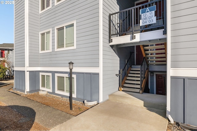 view of side of home featuring a balcony