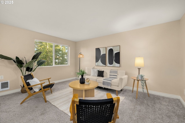 living room featuring heating unit and light carpet