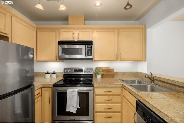 1500 SW Park Ave Unit 429, Portland, OR 97201 - kitchen with stainless steel appliances, light brown cabinets, a sink, and tile counters