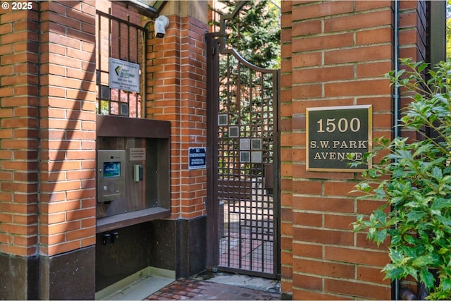 1500 SW Park Ave Unit 429, Portland, OR 97201 - property entrance featuring brick siding and a gate