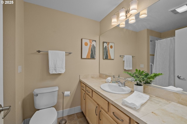 1500 SW Park Ave Unit 429, Portland, OR 97201 - full bathroom with toilet, vanity, baseboards, tile patterned floors, and a shower with shower curtain