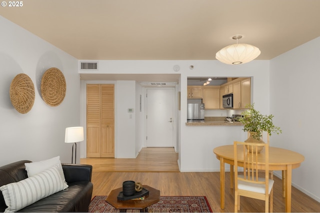 1500 SW Park Ave Unit 429, Portland, OR 97201 - living room with light wood-style flooring and baseboards