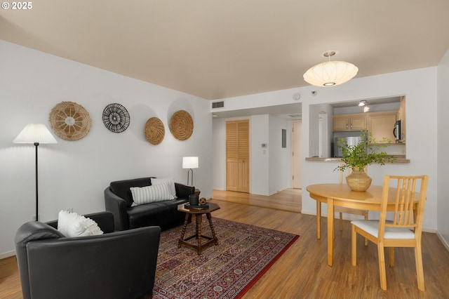 1500 SW Park Ave Unit 429, Portland, OR 97201 - living area featuring light wood-style flooring and baseboards