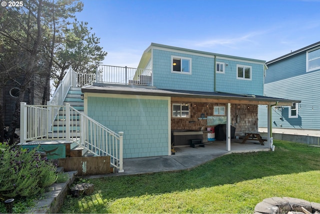 back of house featuring a yard and a patio