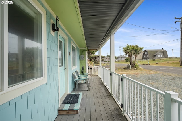 wooden deck featuring covered porch