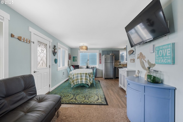 dining area with hardwood / wood-style floors