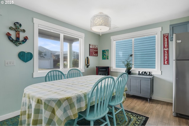 dining area with light hardwood / wood-style flooring