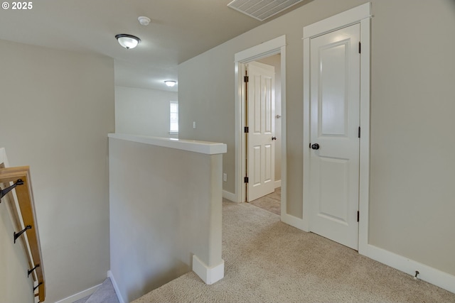 2514 NW Parnell Ter, Portland, OR 97229 - hallway with an upstairs landing and light carpet