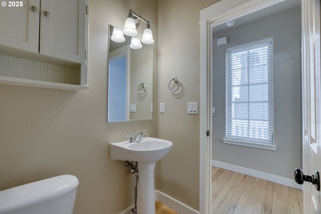 2514 NW Parnell Ter, Portland, OR 97229 - half bathroom with plenty of natural light and wood finished floors