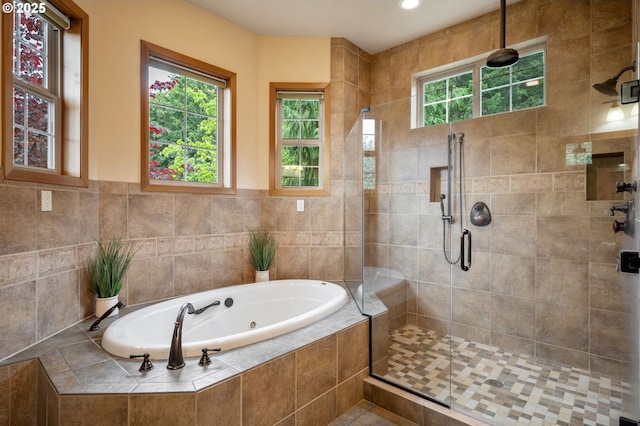 bathroom featuring plus walk in shower