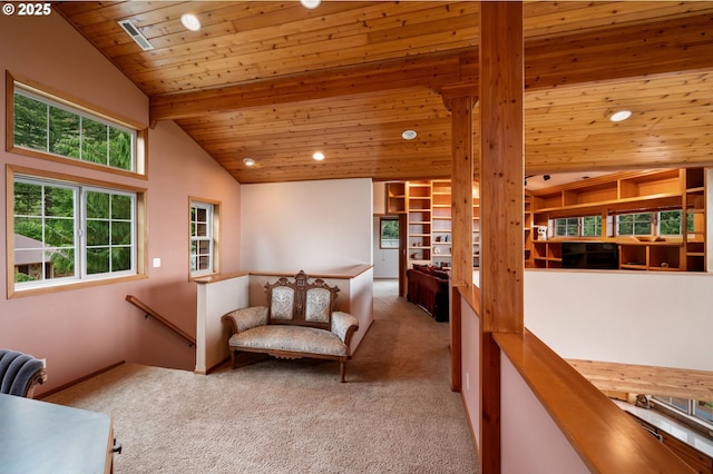 carpeted living room featuring lofted ceiling with beams and wood ceiling