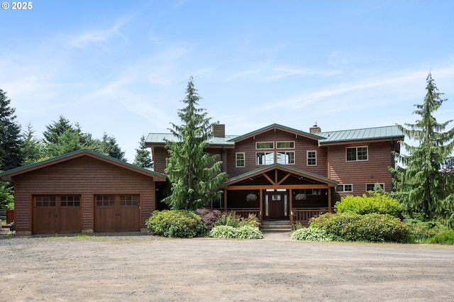 view of front of house with a porch and a garage