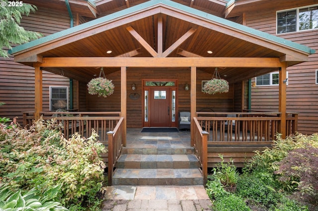 doorway to property featuring a porch