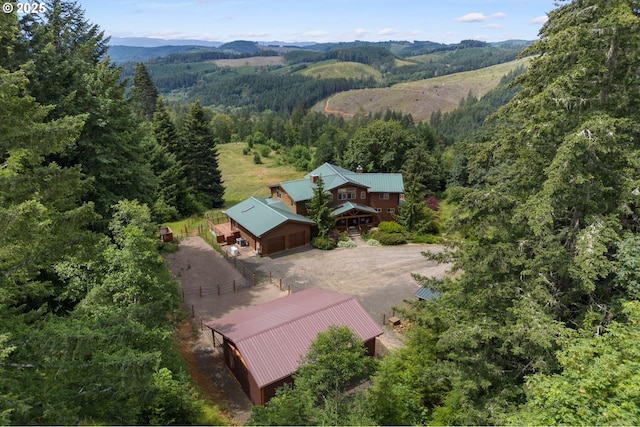 birds eye view of property featuring a mountain view