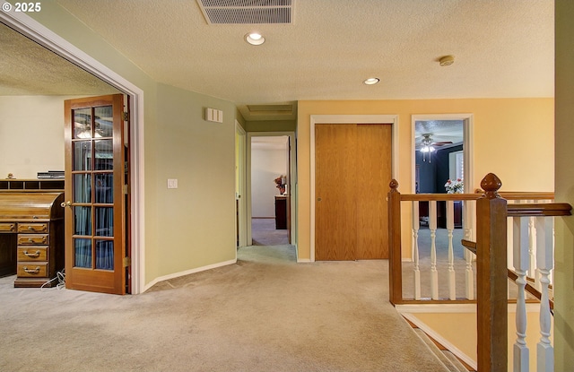10535 SW 135th Ave, Beaverton, OR 97008 - corridor featuring carpet floors, an upstairs landing, a textured ceiling, and recessed lighting