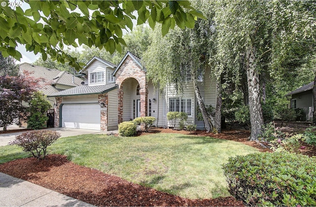 10535 SW 135th Ave, Beaverton, OR 97008 - traditional-style home with a front yard, driveway, a garage, and stone siding