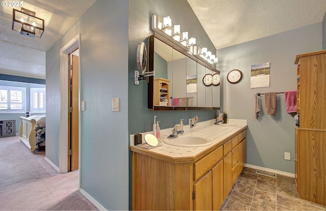 10535 SW 135th Ave, Beaverton, OR 97008 - ensuite bathroom with a textured ceiling and double vanity