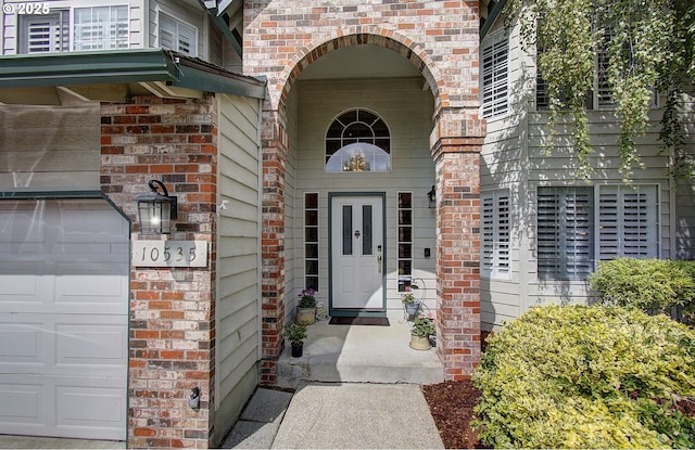 10535 SW 135th Ave, Beaverton, OR 97008 - doorway to property with brick siding and a garage
