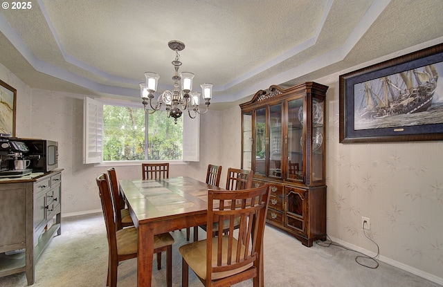 10535 SW 135th Ave, Beaverton, OR 97008 - dining area with a raised ceiling, a chandelier, light carpet, and a textured ceiling