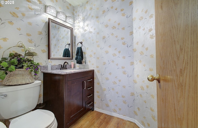 10535 SW 135th Ave, Beaverton, OR 97008 - half bath with wood finished floors, wallpapered walls, and vanity