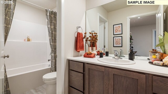 full bathroom with shower / bath combination with curtain, toilet, and vanity